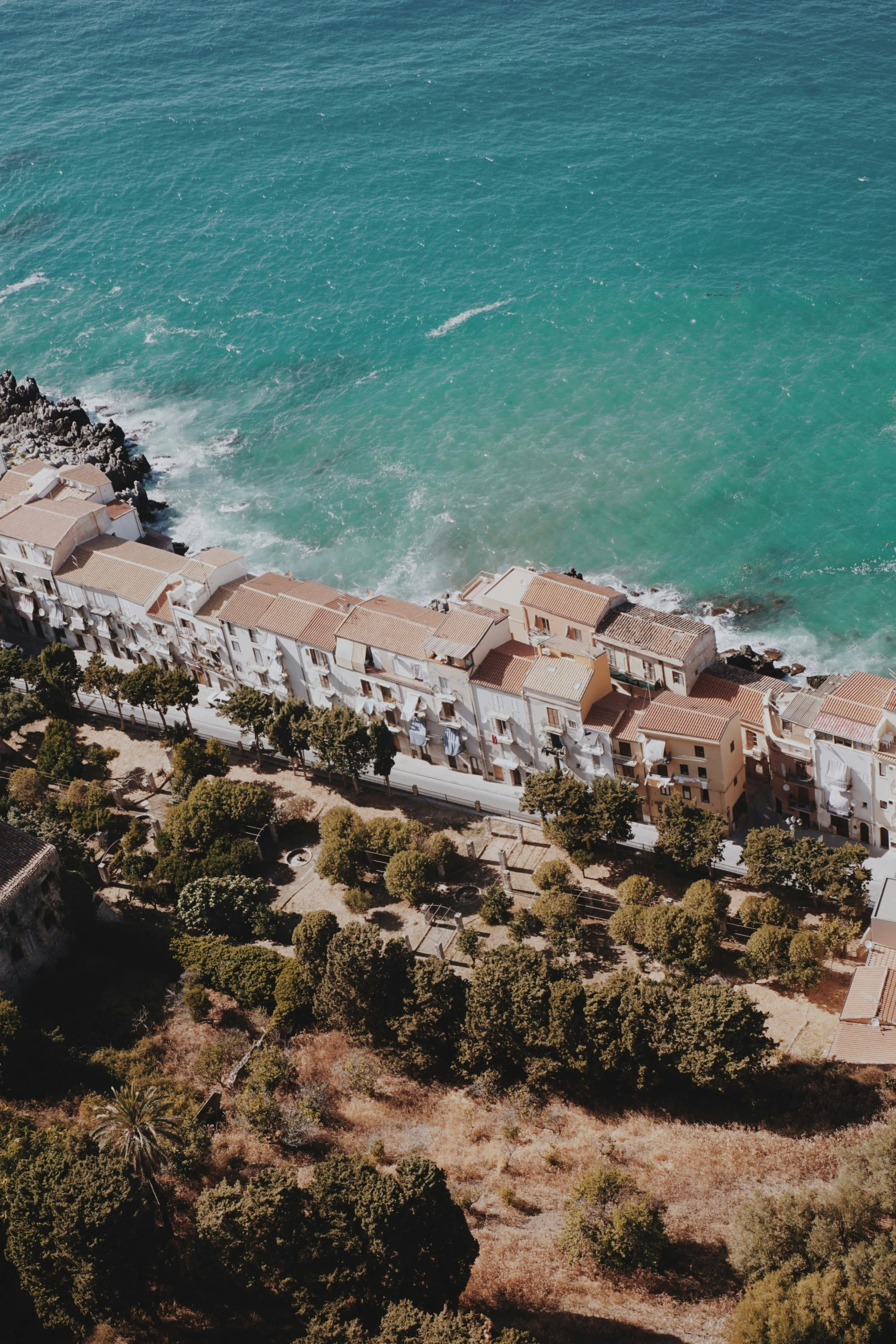 an aerial view of a beach and pier