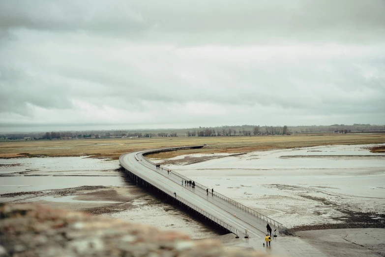 an overhead s of a flooded road in the country