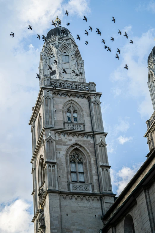 a very tall clock tower with many clocks