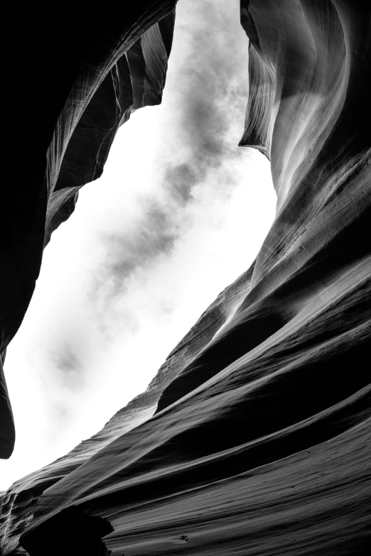 a person is walking in a canyon with mountains in the background