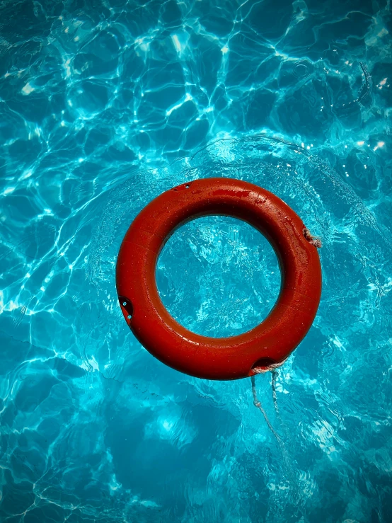 an empty life preserver in a pool of water