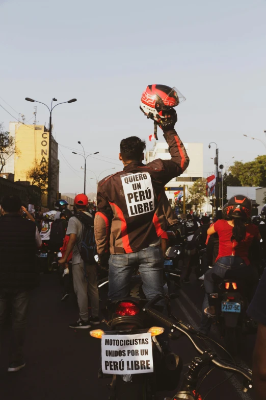 a man with a helmet and gloves on riding a motorcycle