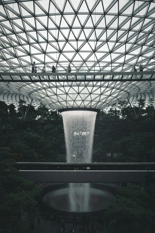 a view from underneath an area with a waterfall