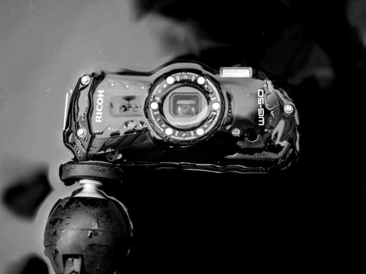 black and white pograph of a small camera