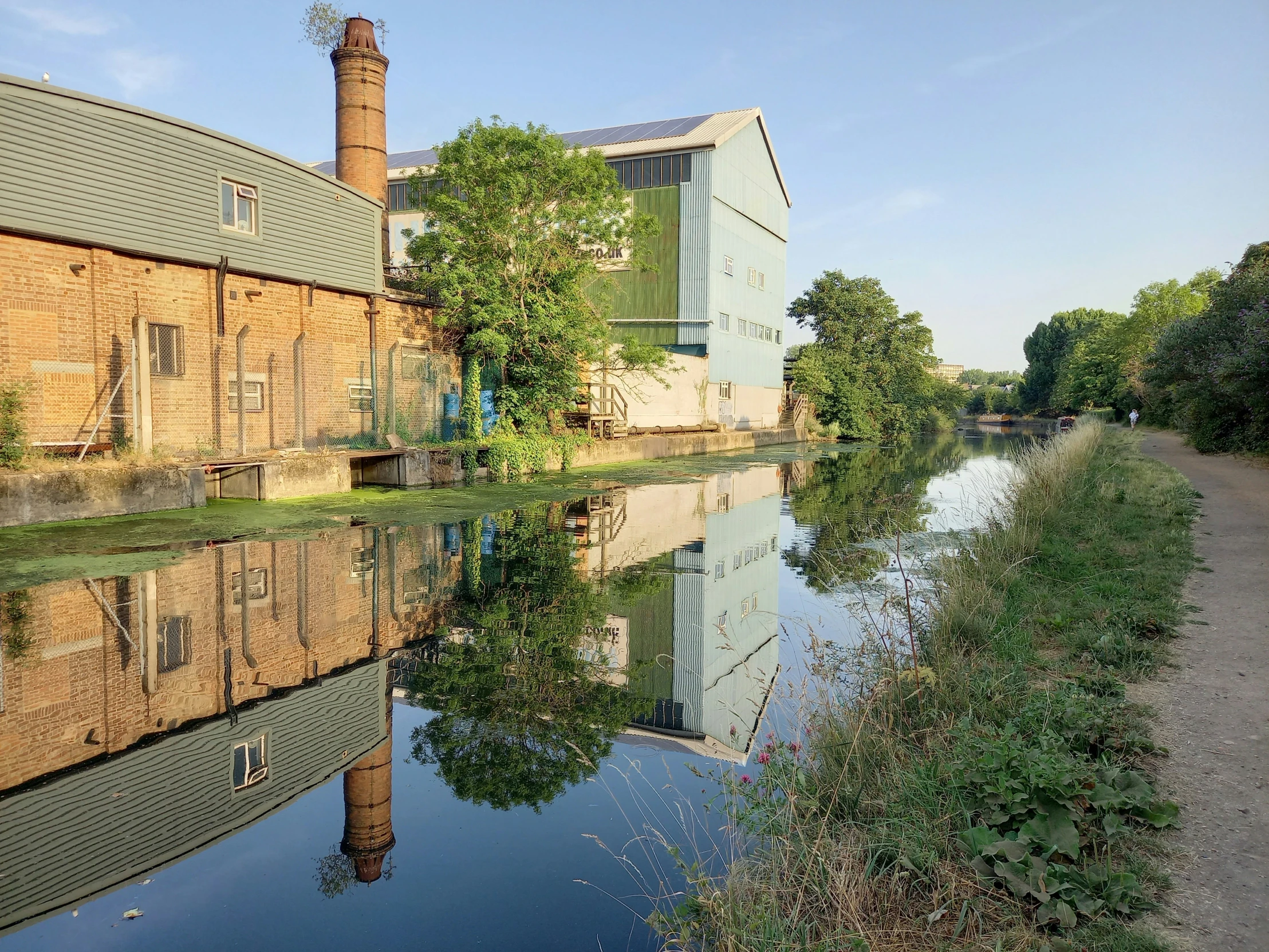 a large building is near a small canal