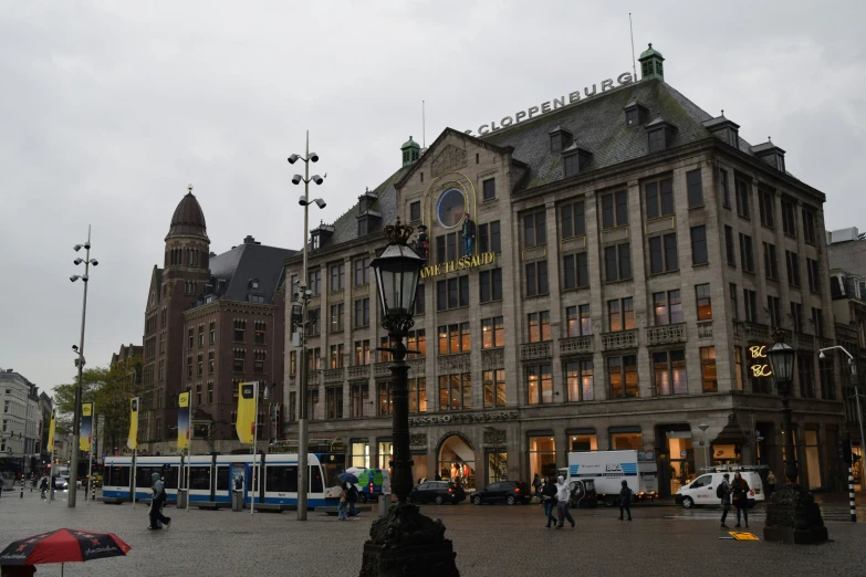 a bus station with lots of people standing around