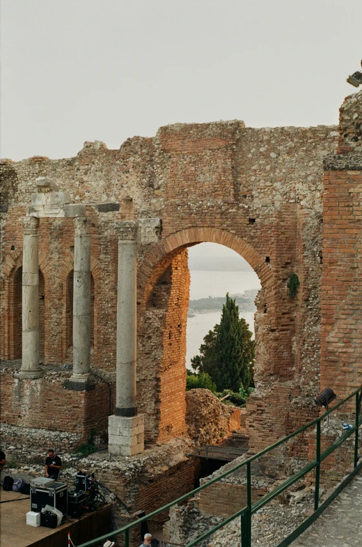 a roman structure and surrounding structures on the side of the road