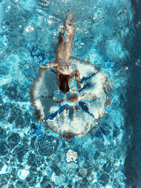 an individual is shown in the water with blue skies