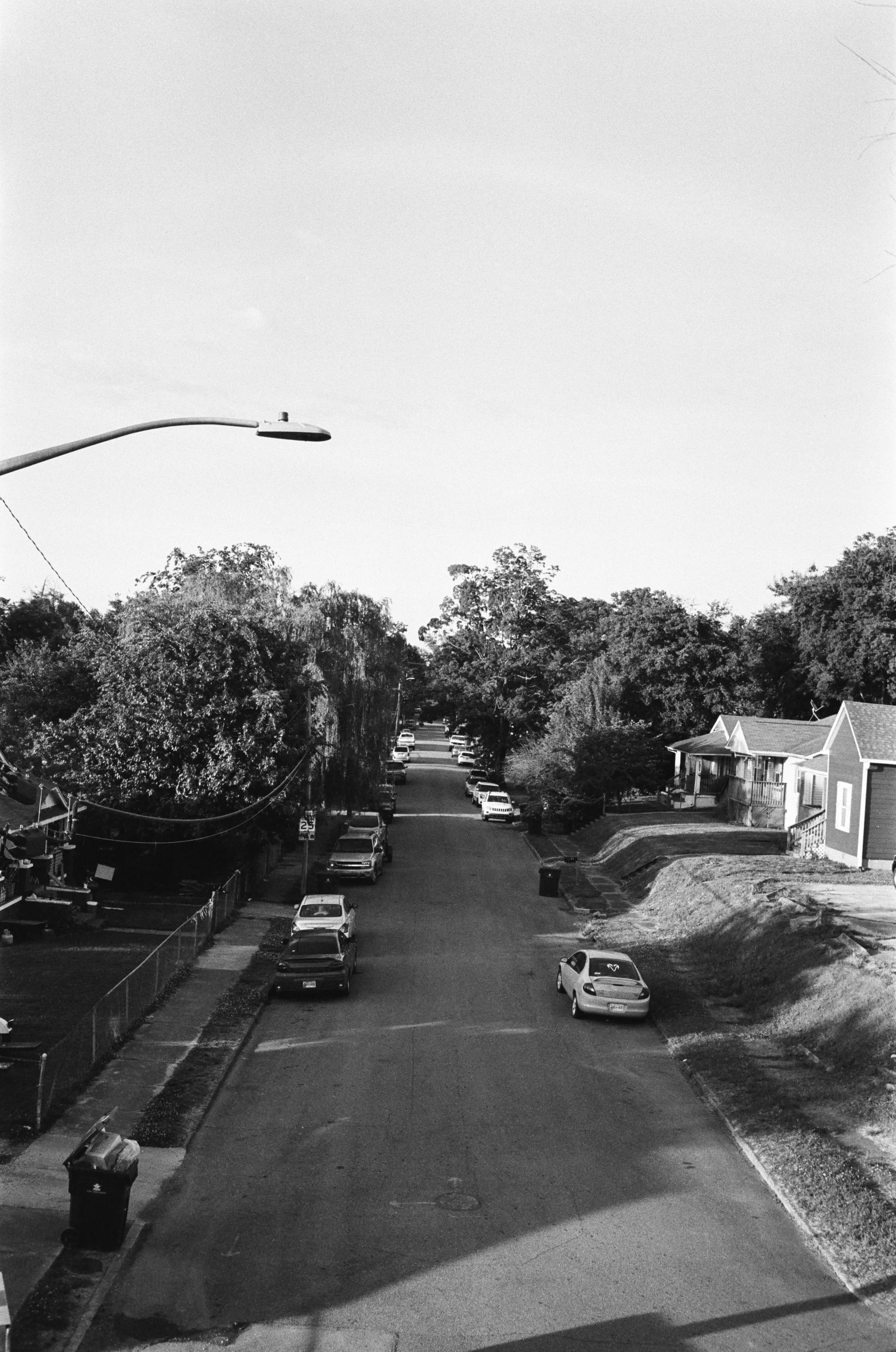 this is an old black and white po of cars on a street