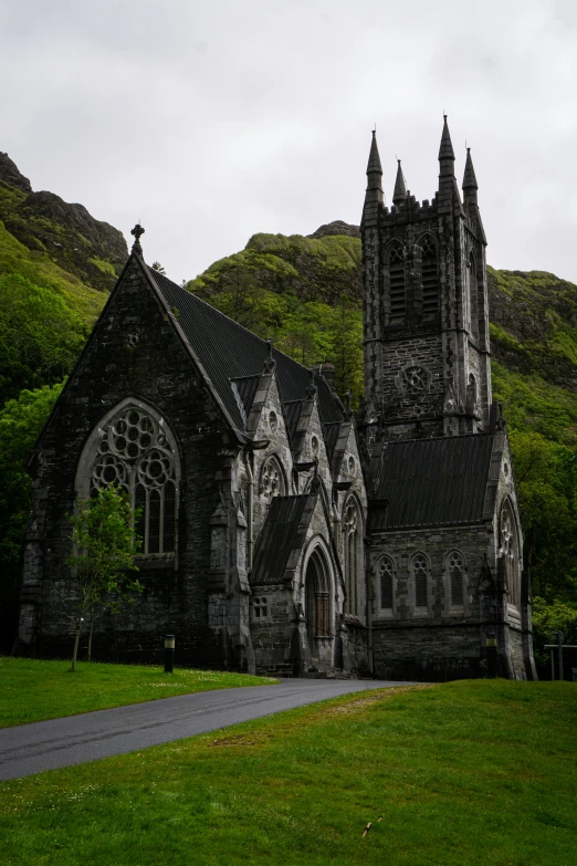 an old church surrounded by lush green grass