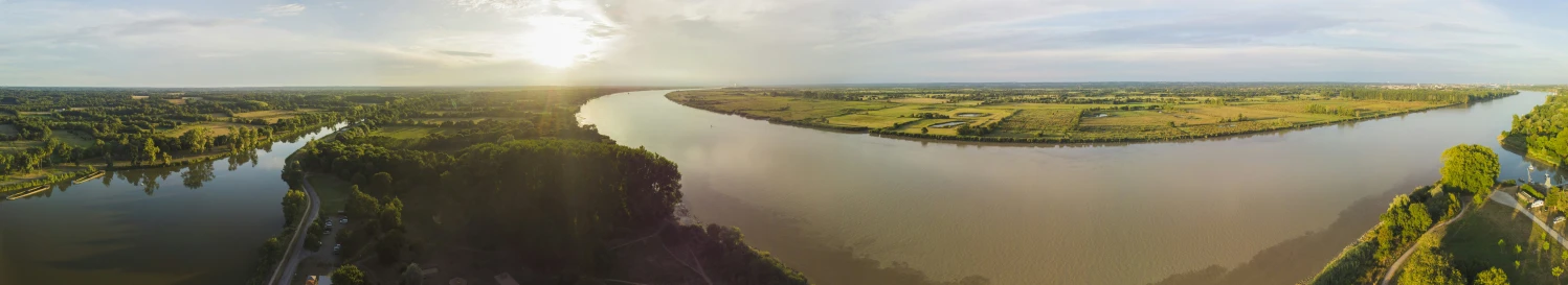 aerial view of a river and some green field