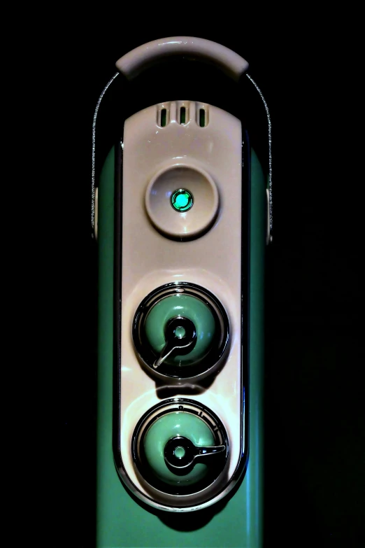 two white speakers with blue sides and black background