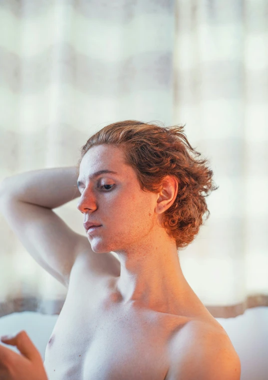 a  woman sitting  on top of a bed