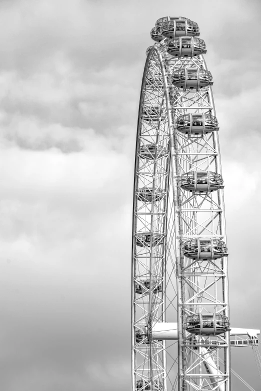 the large ferris wheel is seen from afar