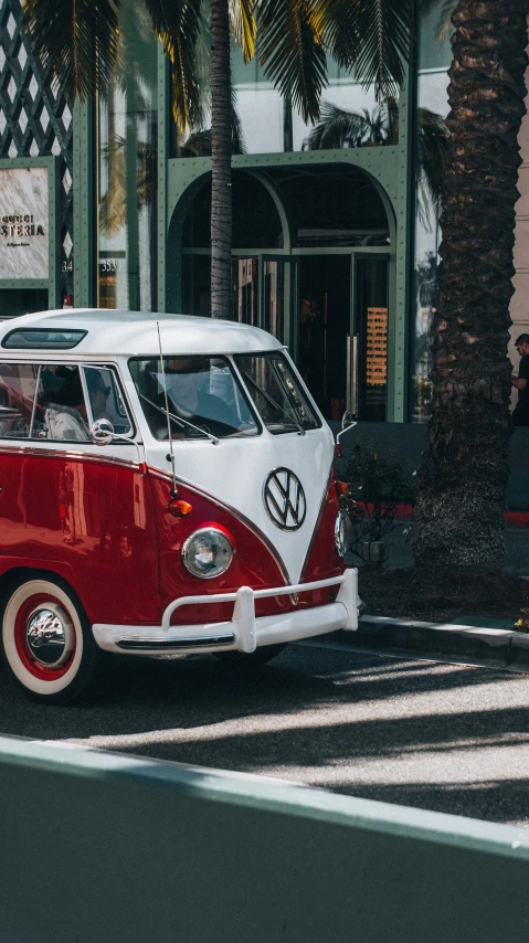 an old red and white van that has some white paint