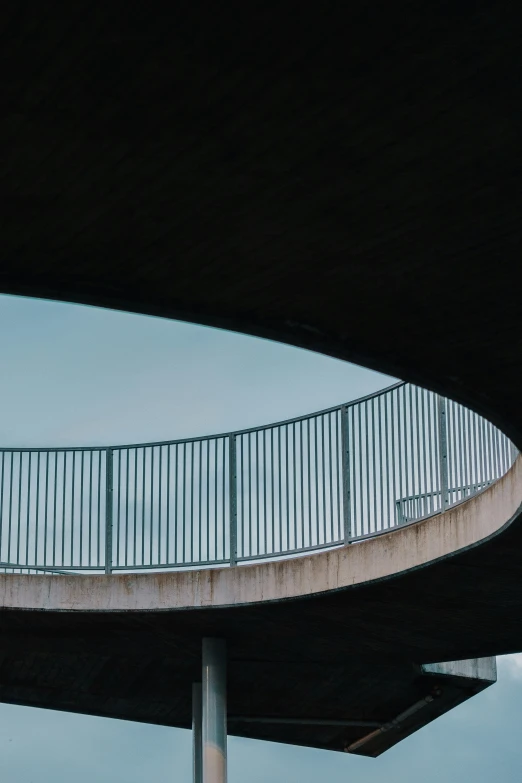 the people are walking up and down this bridge