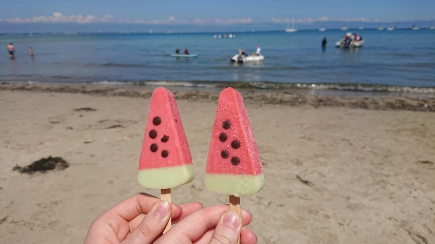 two pops in watermelon shaped like small boats