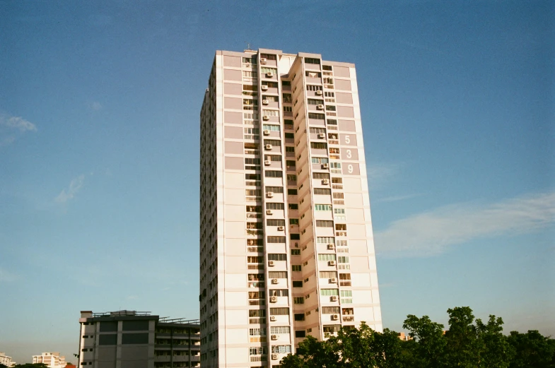 an apartment building against the blue sky
