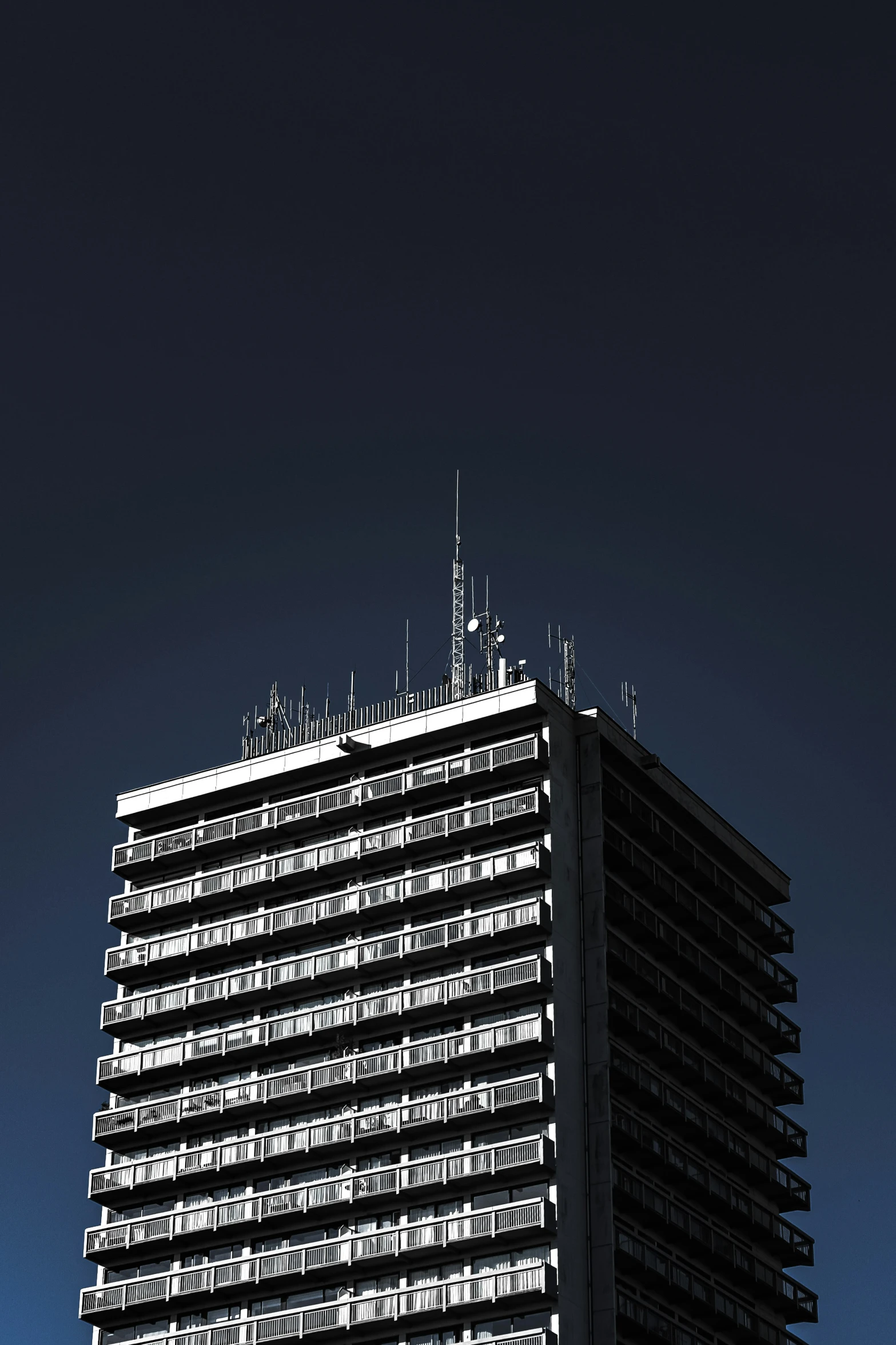 the top of an office building with a sky background