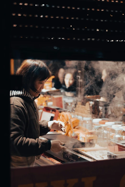 there is a woman that is at a kitchen