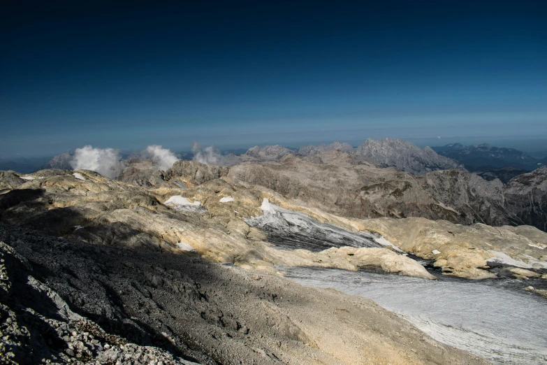 the mountains are covered in rock and snow