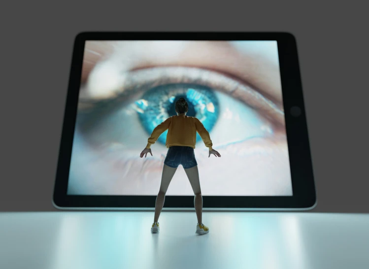 a person standing with their hands outstretched over a tablet