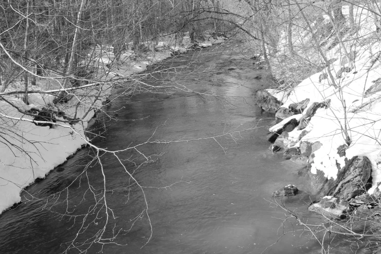 the snowy banks of the stream are clear