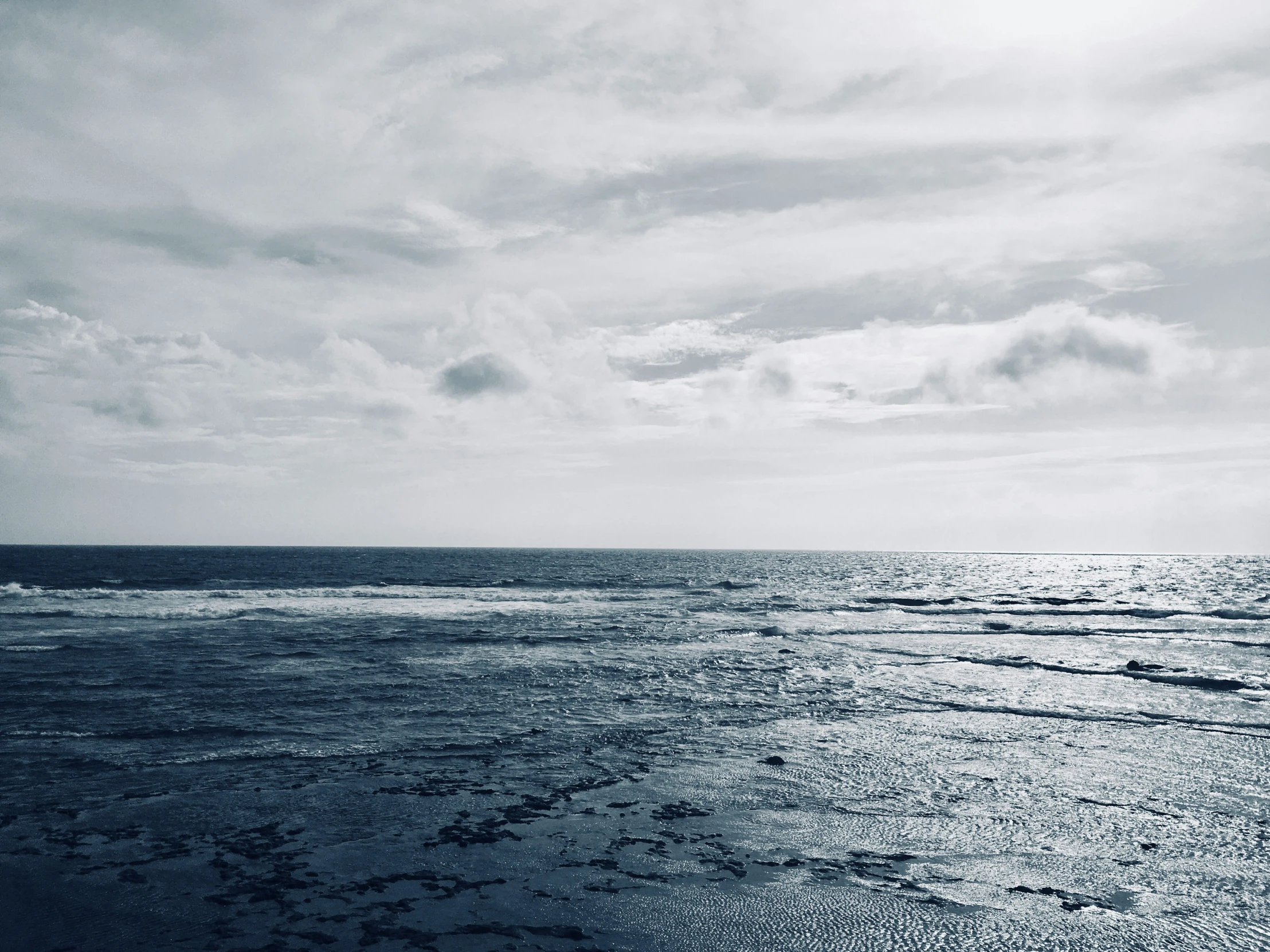 a view of an ocean from the shore