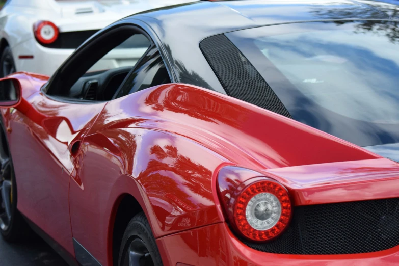 a red sports car parked on the side of the street