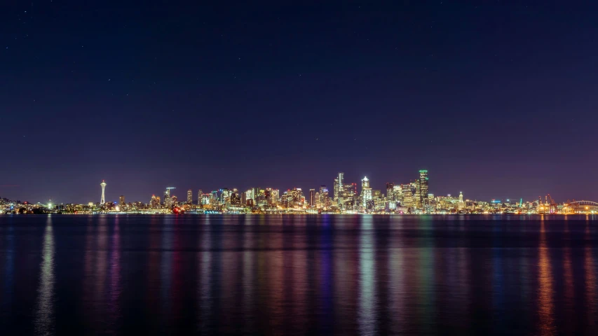 a view of a city skyline with lights at night