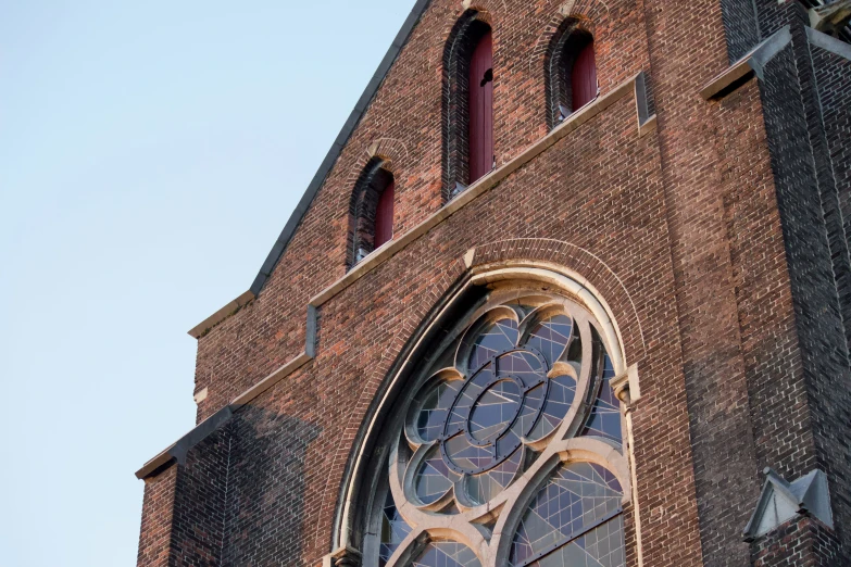 there is an old church building with stained glass windows