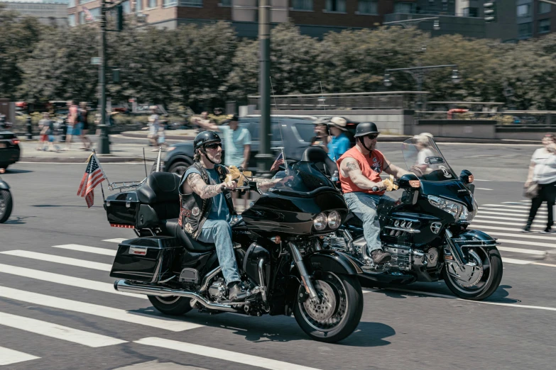 there are some bikers driving on the street