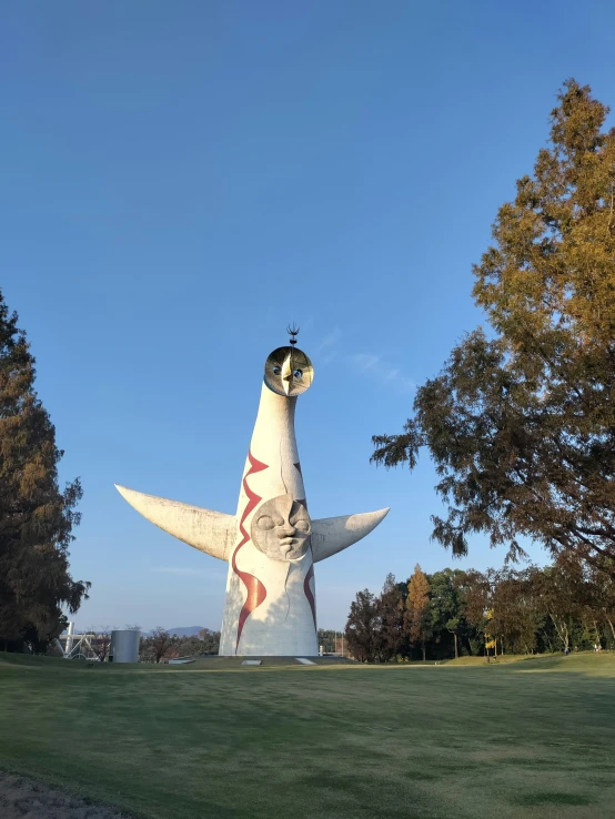 a giant white bird with it's wings spread out