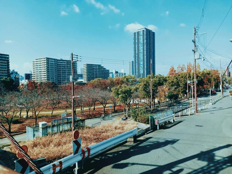 a person is standing on a railing overlooking the streets