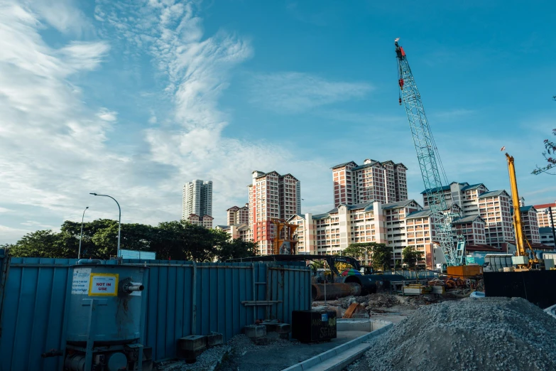 there are cranes in the middle of construction on a big city