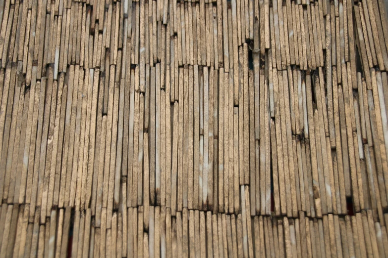 closeup of a roof made from wood logs