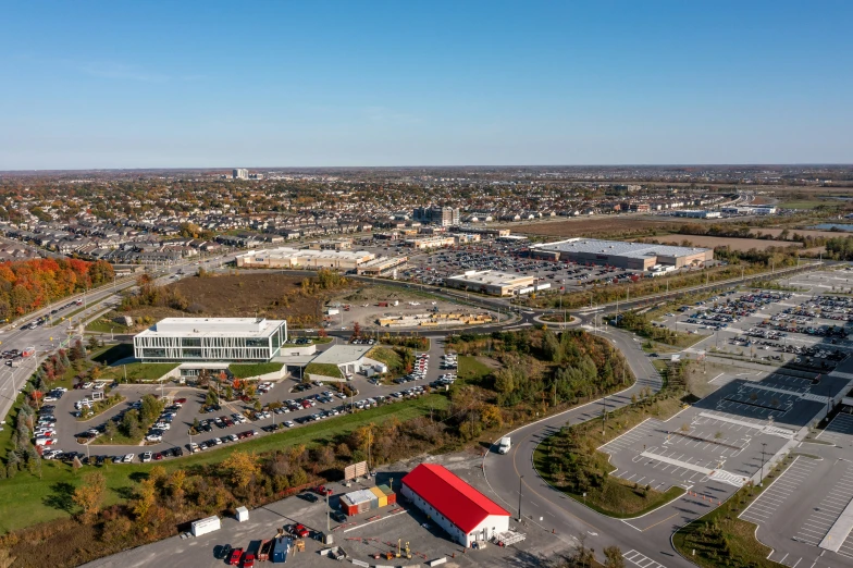 an aerial view of a parking lot, with cars parked on the lot