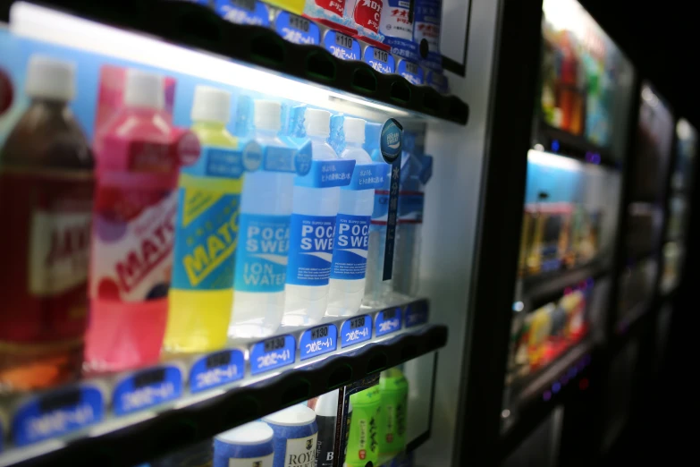 there is a display with soda and water bottles