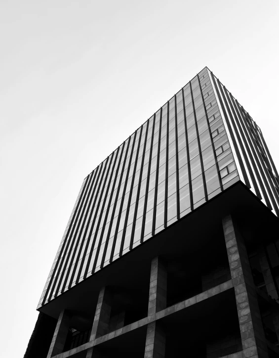 black and white pograph of the corner of a tall building