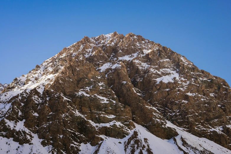 a mountain is in the distance, covered in snow