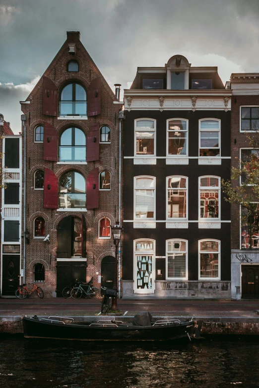 a brick building with many windows on the other side of it