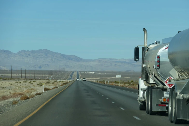 a large semi truck is on the highway