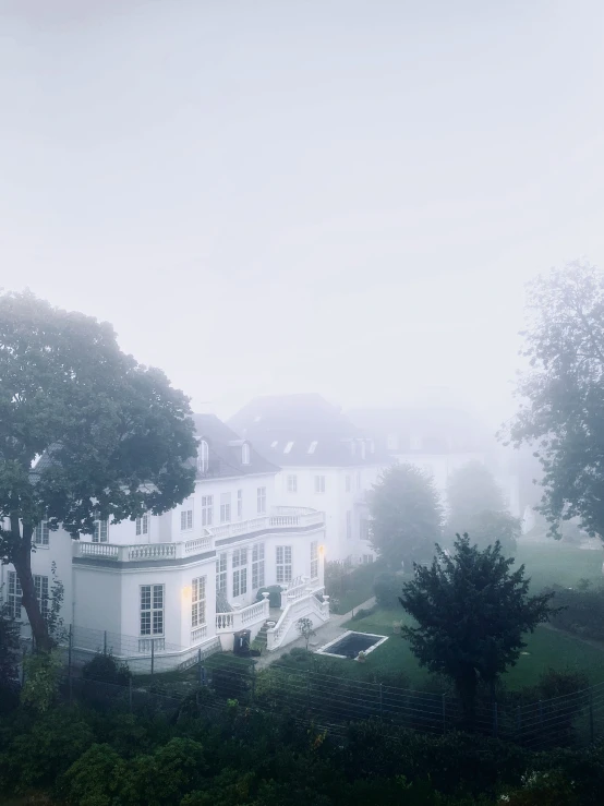 an image of a mansion in the fog