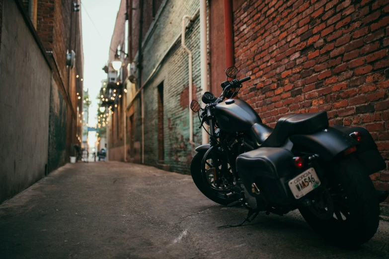 a very nice looking motorcycle by a building