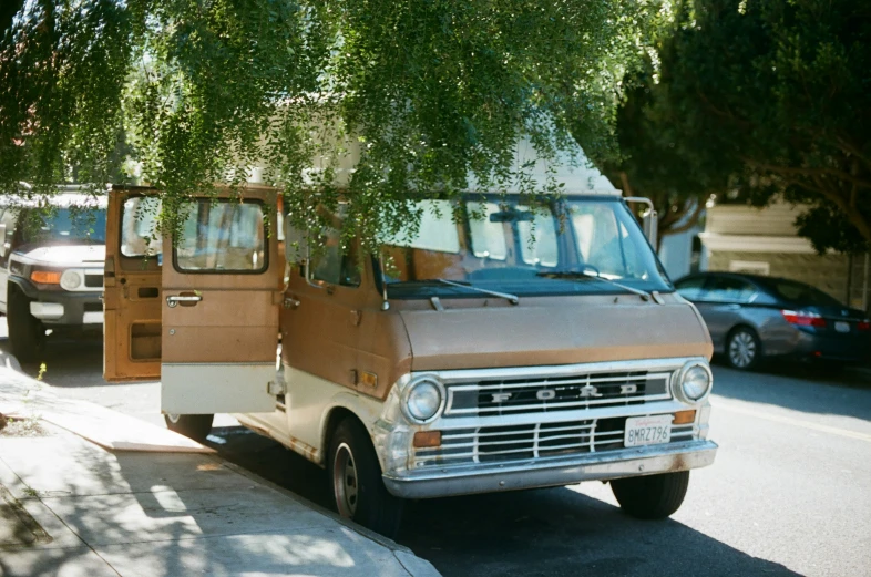 a truck with a bus and camper on the side of it