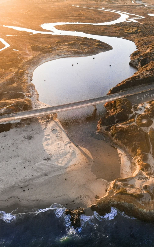 this is an aerial s of a road between two lakes