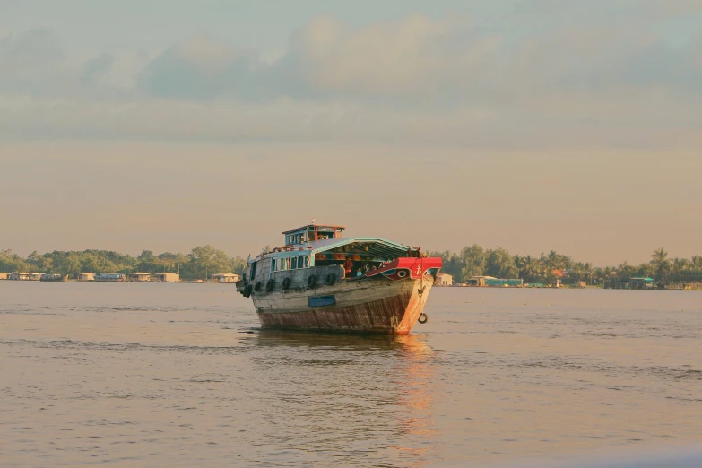 a boat with people riding on the stern