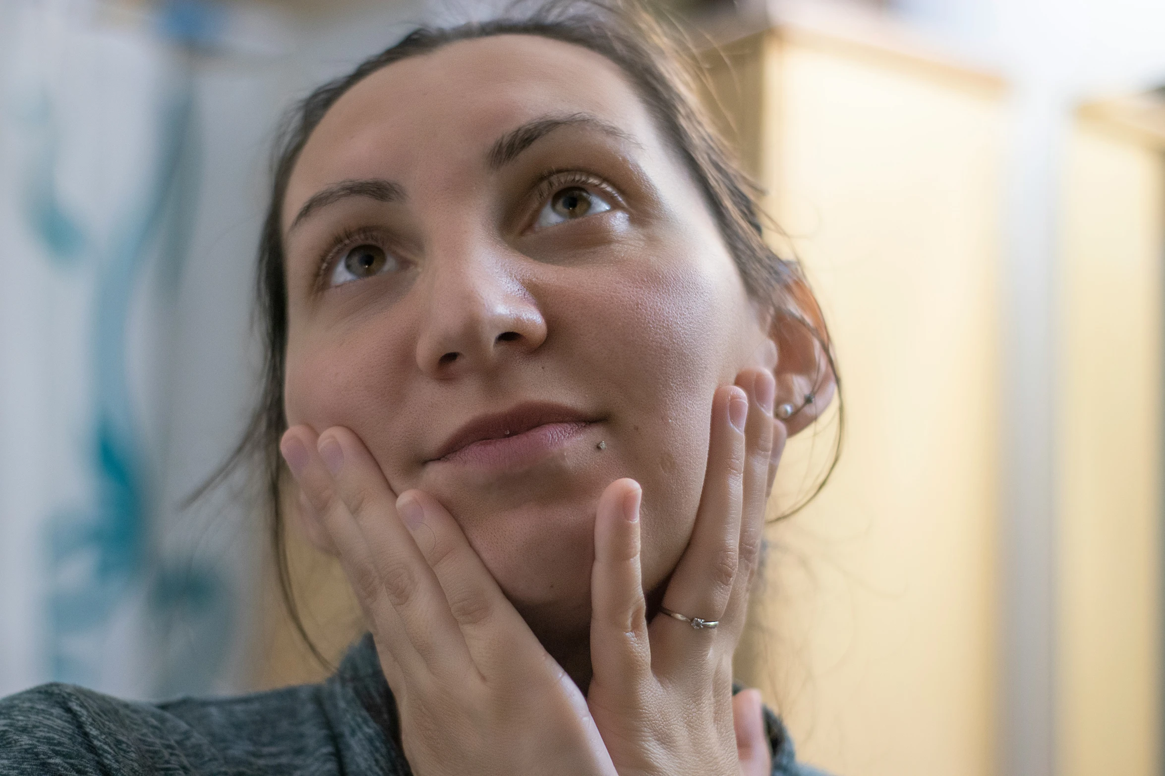 a woman is looking out the window and smiling