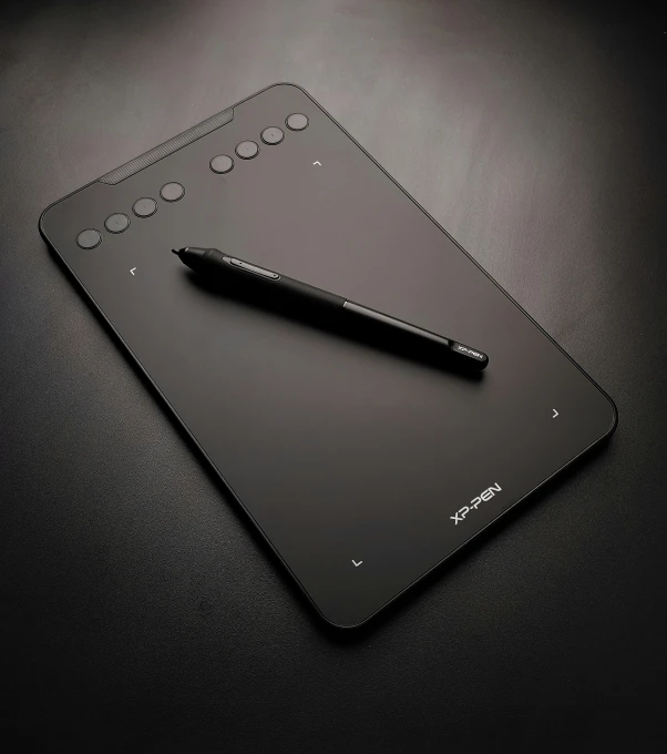 a black tablet with an object like pen on it