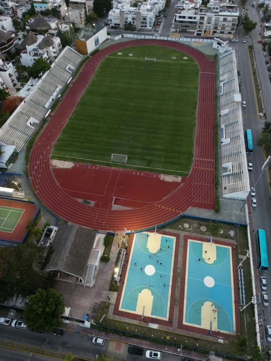 an aerial view of a large sports stadium in the city